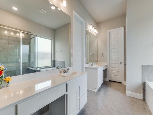 full bath with a bath, a stall shower, visible vents, and a sink