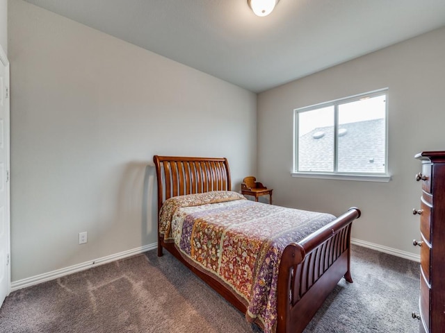 carpeted bedroom featuring baseboards