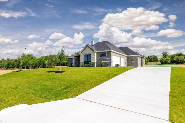 view of front of home with a front yard, concrete driveway, brick siding, and an attached garage