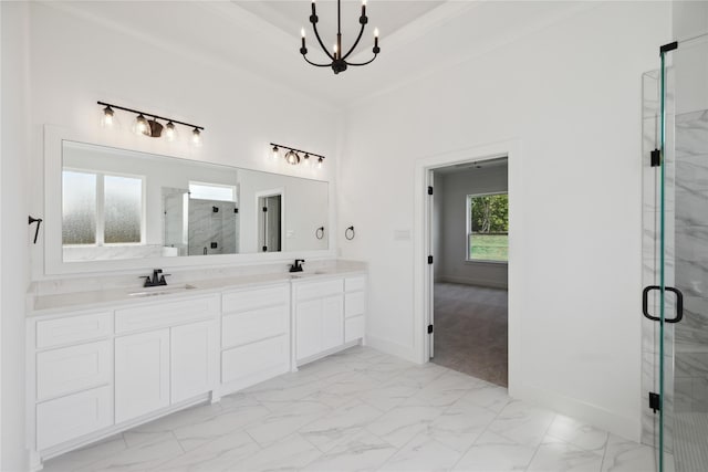 bathroom with marble finish floor, a raised ceiling, a sink, and a marble finish shower