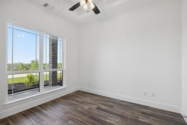 unfurnished room with dark wood-style floors, crown molding, baseboards, and a wealth of natural light