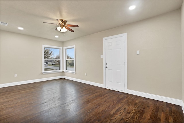 spare room with ceiling fan, dark wood-type flooring, recessed lighting, and baseboards