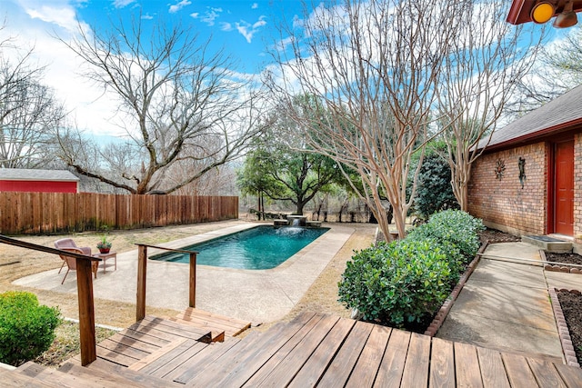 view of pool with a patio, a fenced backyard, and a fenced in pool