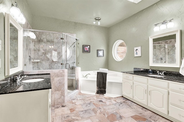 bathroom with a garden tub, a sink, and a shower stall