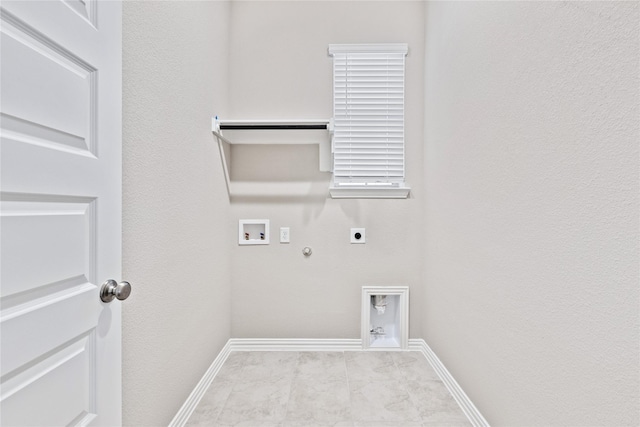 laundry area featuring laundry area, baseboards, gas dryer hookup, washer hookup, and electric dryer hookup