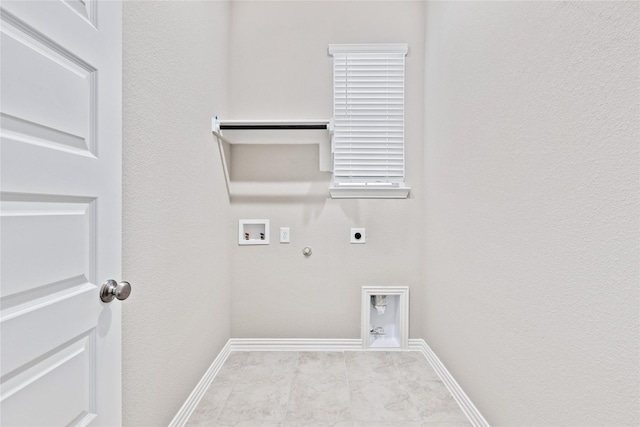 laundry area featuring hookup for a washing machine, gas dryer hookup, electric dryer hookup, laundry area, and baseboards