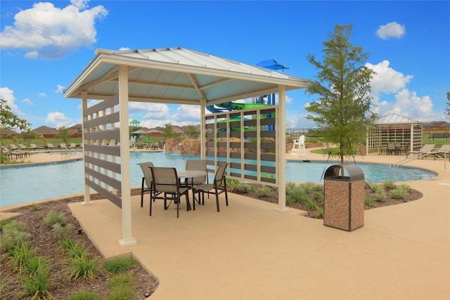 view of patio / terrace featuring a gazebo and a community pool