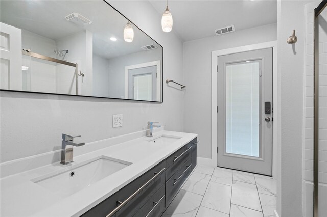 kitchen featuring gray cabinets, stainless steel appliances, a sink, white cabinetry, and tasteful backsplash