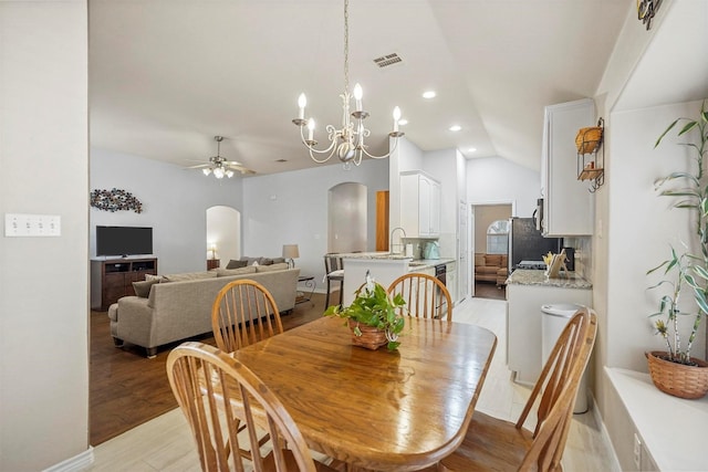 dining room with arched walkways, recessed lighting, a ceiling fan, visible vents, and light wood-style floors