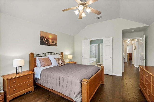 bedroom with lofted ceiling, dark wood finished floors, visible vents, a ceiling fan, and ensuite bath