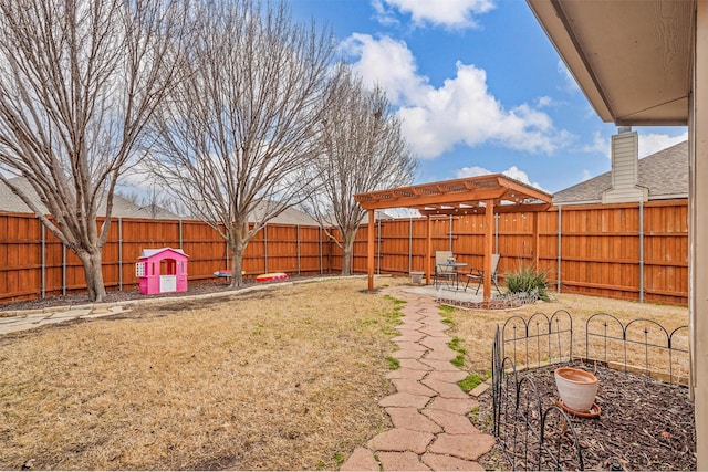 view of yard featuring a patio area and a fenced backyard