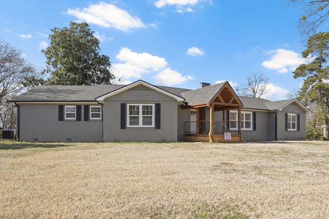 ranch-style home featuring central AC unit, a chimney, crawl space, a front lawn, and brick siding