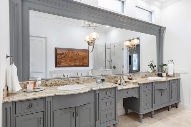 bathroom with ornamental molding, a sink, a shower stall, and double vanity