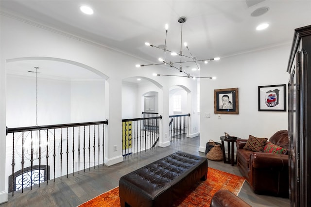 sitting room featuring recessed lighting, an inviting chandelier, and crown molding