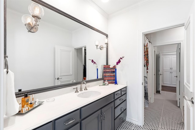 bathroom featuring ornamental molding and vanity