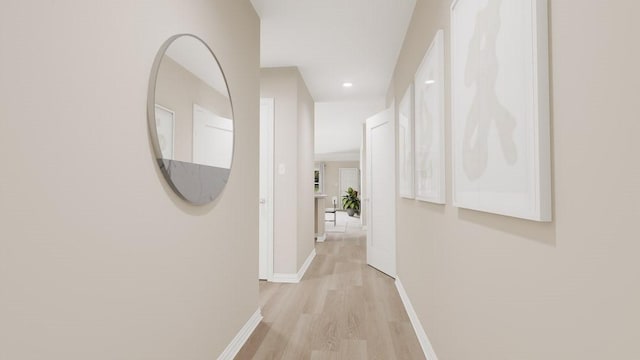 corridor featuring recessed lighting, light wood-type flooring, and baseboards