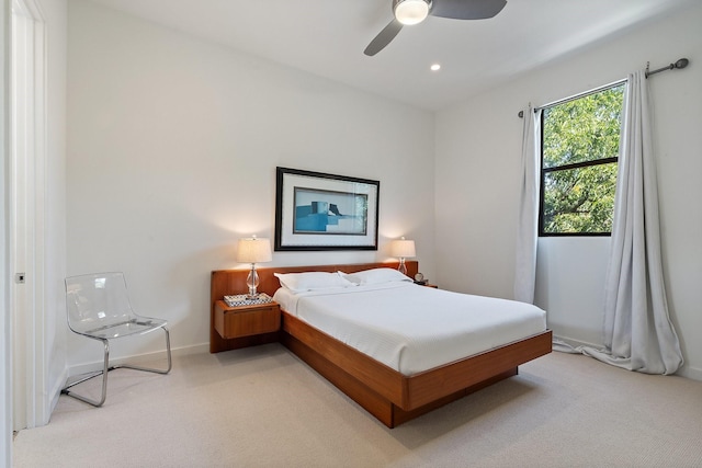 bedroom featuring light colored carpet, baseboards, ceiling fan, and recessed lighting