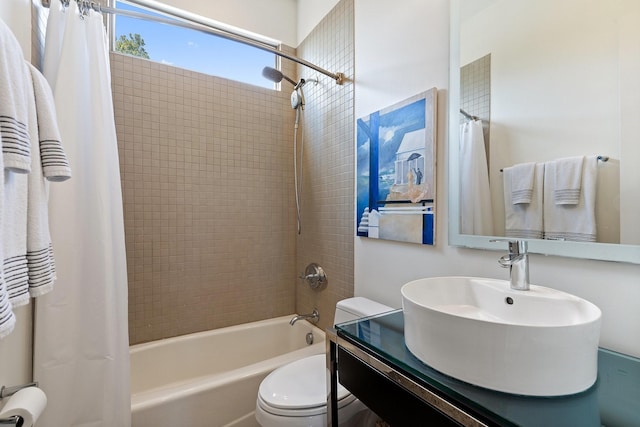 full bathroom with toilet, shower / bathtub combination with curtain, and vanity