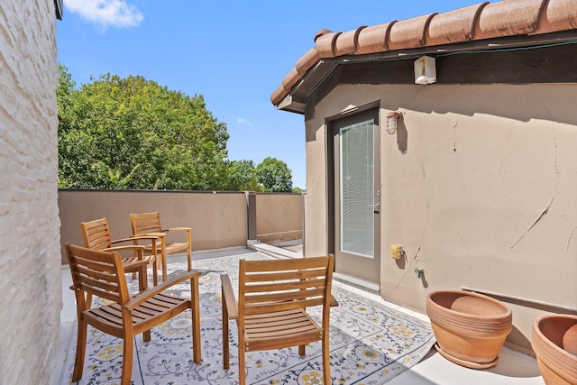 view of patio featuring fence