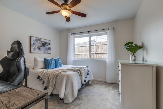 bedroom with carpet, baseboards, and a ceiling fan