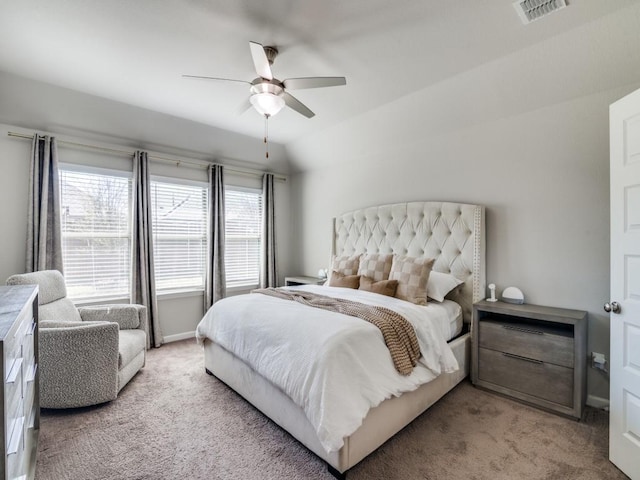 carpeted bedroom featuring baseboards, visible vents, and a ceiling fan