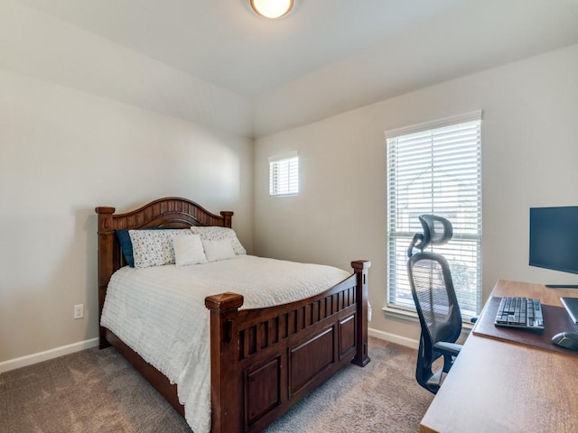 bedroom with light carpet and baseboards