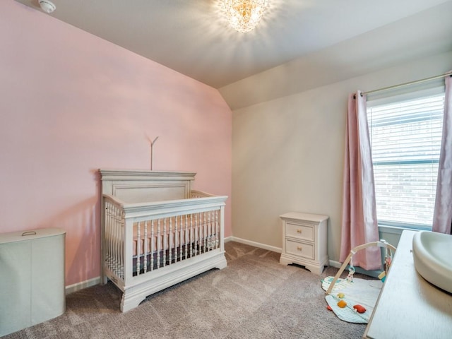 bedroom featuring carpet, multiple windows, lofted ceiling, and baseboards