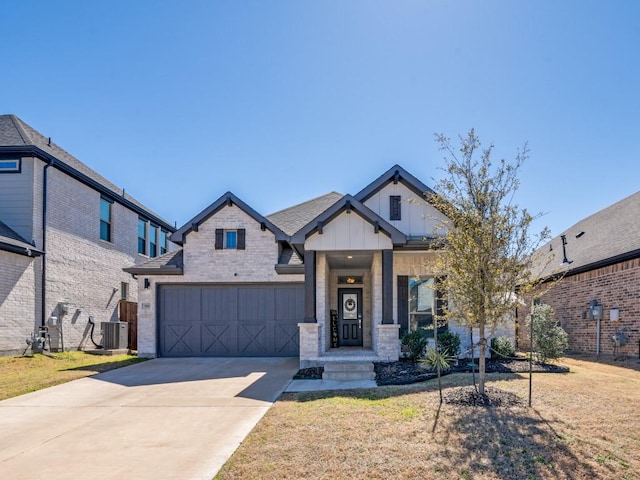 view of front of house featuring cooling unit, brick siding, concrete driveway, board and batten siding, and a front yard