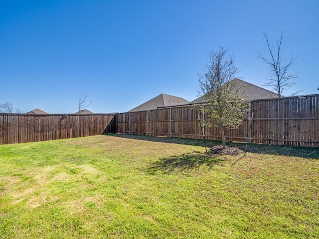 view of yard featuring a fenced backyard