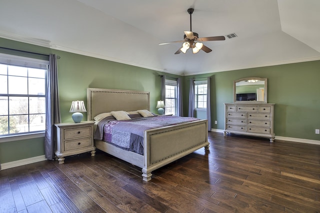 bedroom featuring ornamental molding, wood-type flooring, visible vents, and baseboards