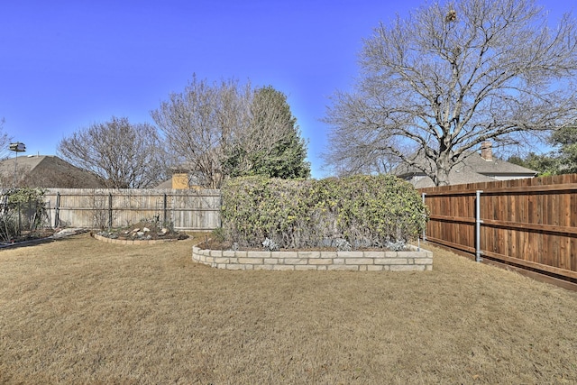 view of yard featuring a fenced backyard