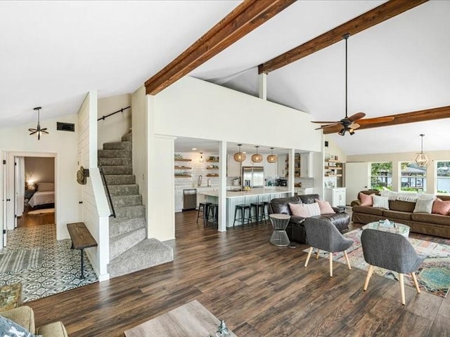 living area featuring ceiling fan, visible vents, stairway, beam ceiling, and dark wood-style floors