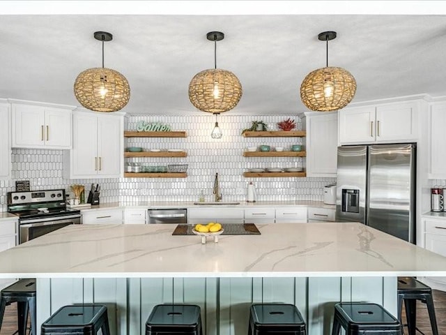 kitchen with open shelves, a sink, white cabinetry, and stainless steel appliances