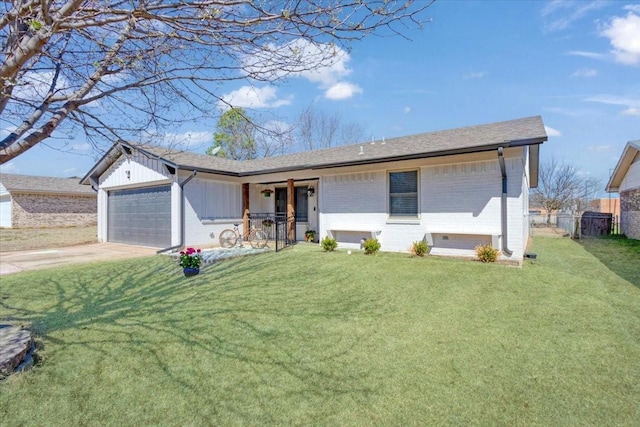 single story home featuring a garage, a front lawn, brick siding, and driveway