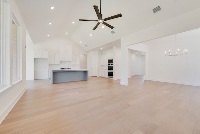 830 Montrose Dr, Rockwall, TX 75087 - unfurnished living room with a chandelier, high vaulted ceiling, recessed lighting, light wood-style floors, and ceiling fan