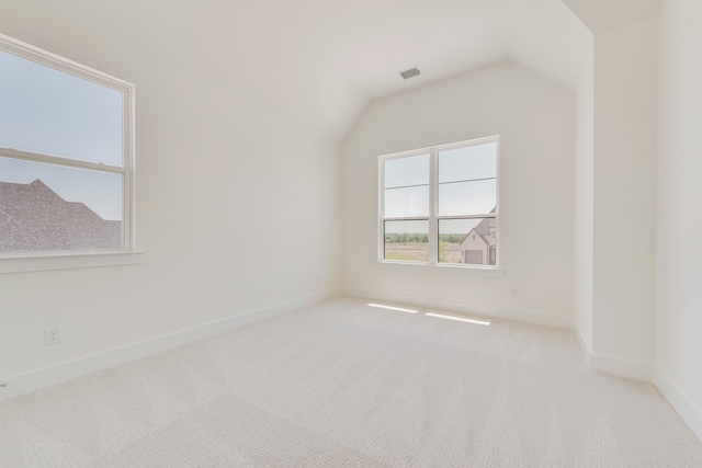 830 Montrose Dr, Rockwall, TX 75087 - spare room with carpet floors and lofted ceiling