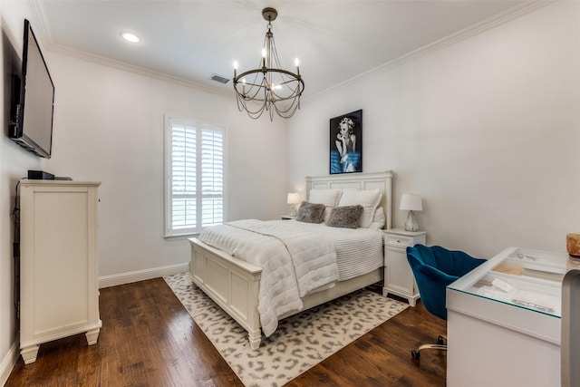 bedroom featuring dark wood-style floors, ornamental molding, visible vents, and a notable chandelier