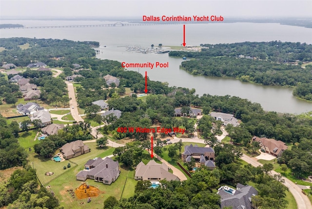 bird's eye view featuring a water view and a residential view