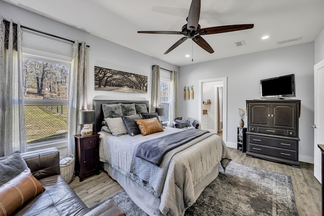 19909 County Road 1102, Flint, TX 75762 - bedroom featuring light wood-style flooring, recessed lighting, baseboards, ceiling fan, and connected bathroom