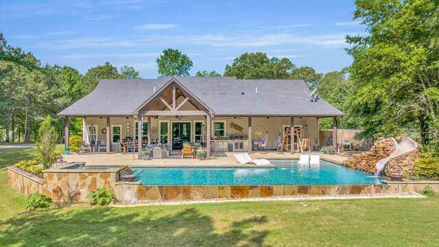 19909 County Road 1102, Flint, TX 75762 - view of pool featuring a ceiling fan, a water slide, an in-ground hot tub, and a patio area