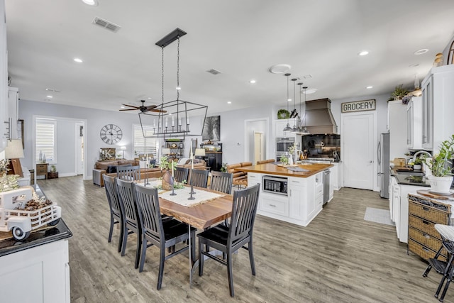 19909 County Road 1102, Flint, TX 75762 - dining area with light wood-type flooring, ceiling fan, recessed lighting, and baseboards