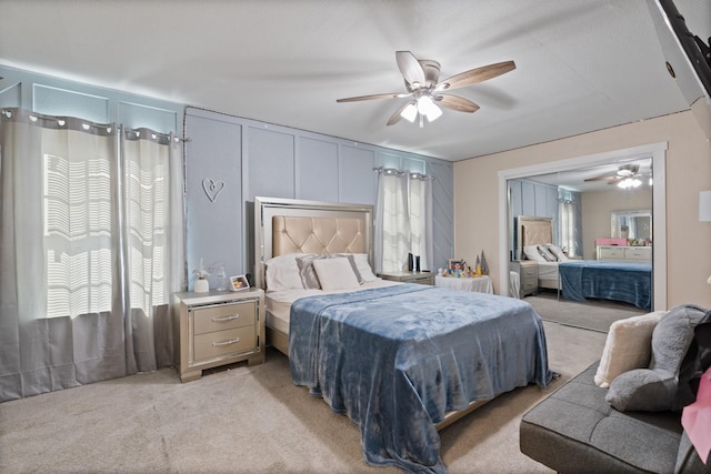 bedroom with light carpet and ceiling fan