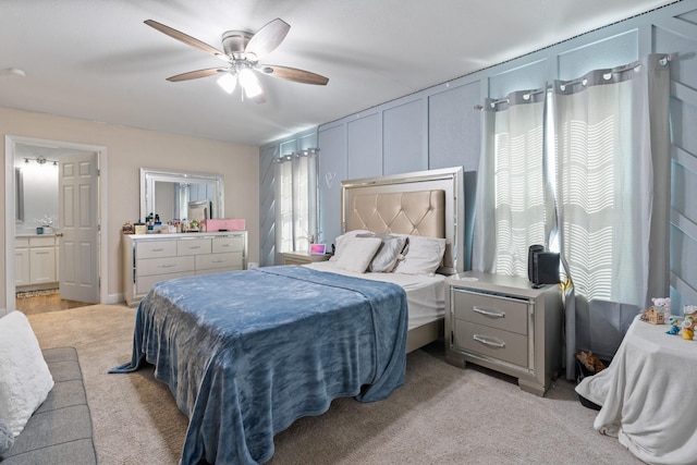 bedroom featuring light carpet and ceiling fan