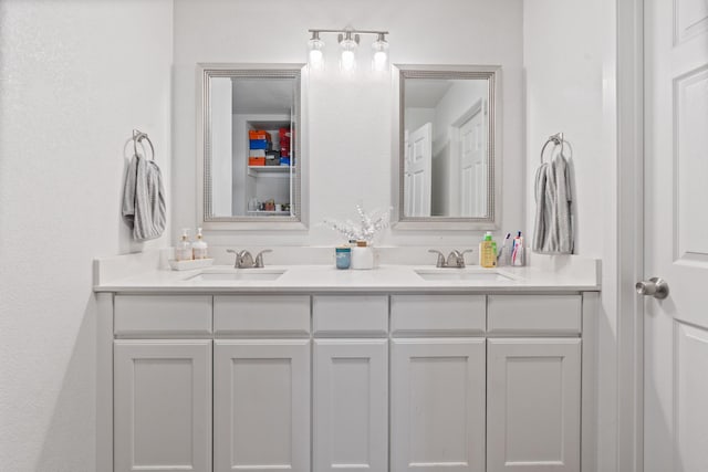 full bath featuring a sink and double vanity