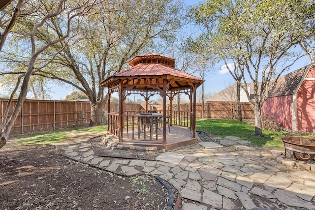 exterior space with a gazebo and a fenced backyard