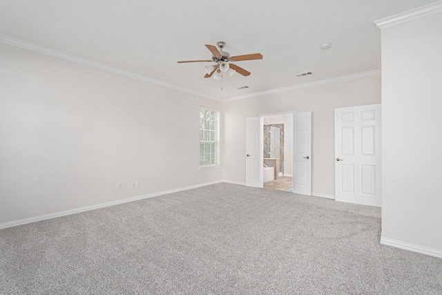 empty room with visible vents, baseboards, ceiling fan, ornamental molding, and carpet