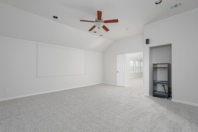 additional living space with carpet, visible vents, vaulted ceiling, ceiling fan, and baseboards