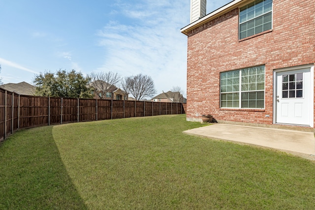 view of yard featuring a patio and a fenced backyard