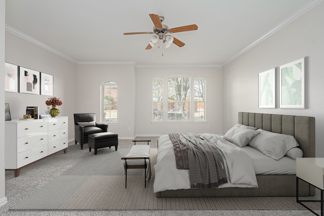 bedroom with carpet, baseboards, ceiling fan, and crown molding