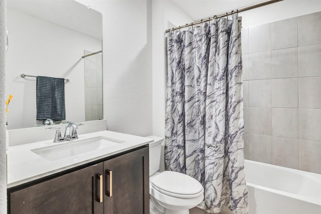 full bath with vanity, toilet, and shower / tub combo